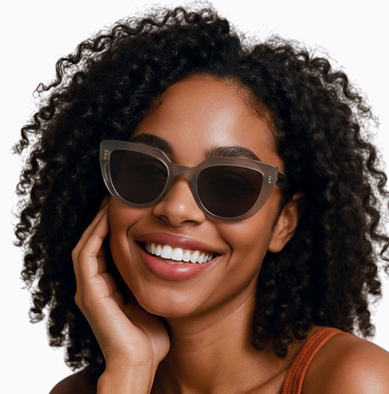 Girl wearing Front view of translucent grey Toni Valencia cat-eye sunglasses.